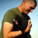 soldier hugging his bomb-sniffing dog